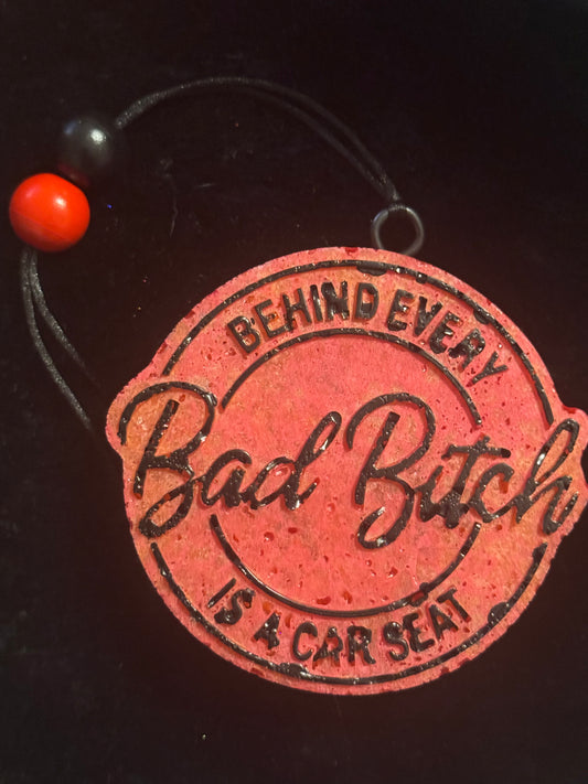 Behind Bad B**ch is a Car Seat